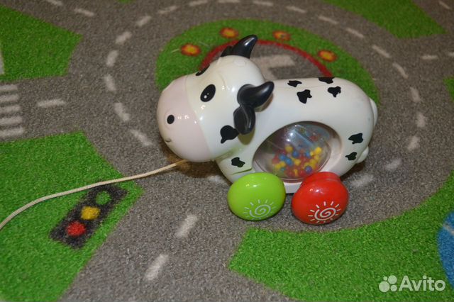 Музыкальная игрушка-каталка корова